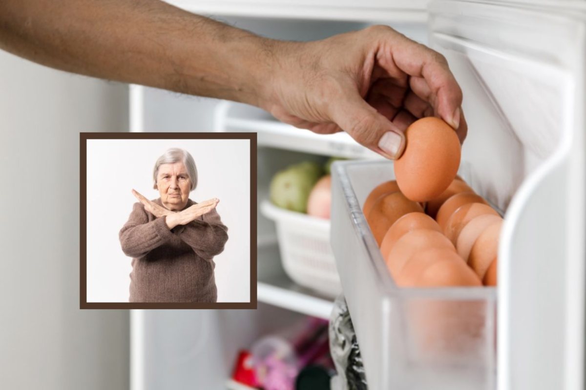 uomo che prende un uovo dalla porta del frigo e donna che dice no con le mani incrociate a x