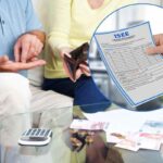 persone che contano i soldi e documento Isee in cornice